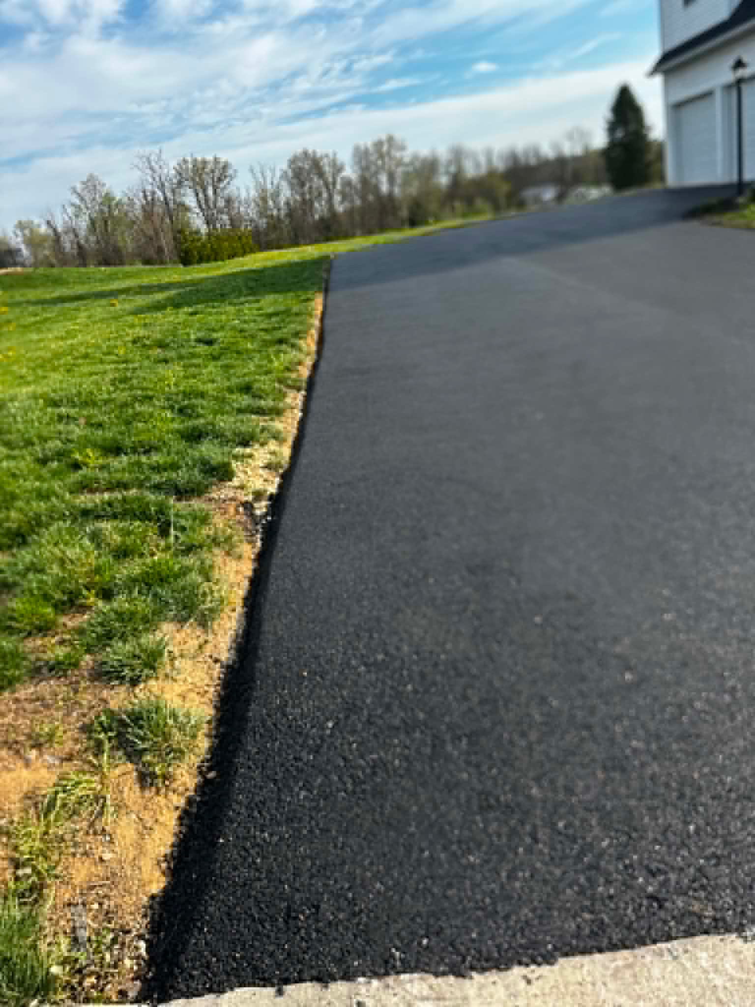 Finished residential asphalt driveway